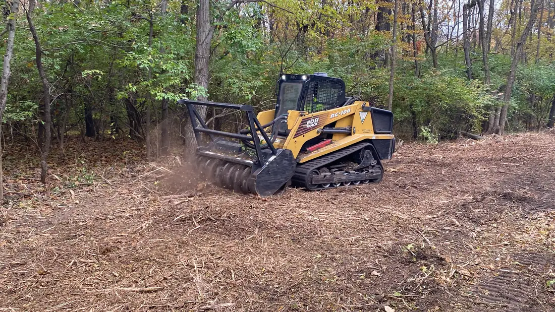 Forestry mulcher working the brush line.