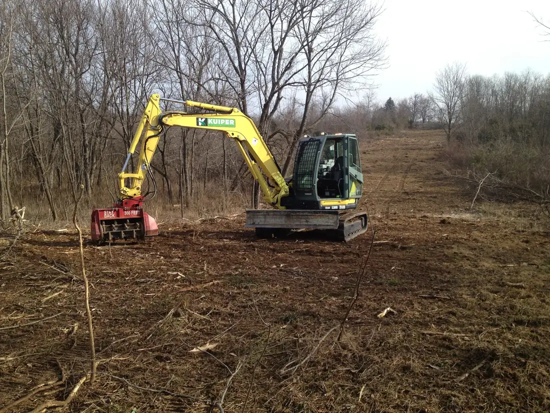 Excavator mulcher opening a right-of-way.